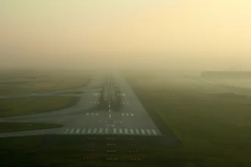 Papier Peint photo Aéroport runway in the fog