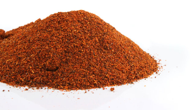 huge mountain of red chili on an isolated background