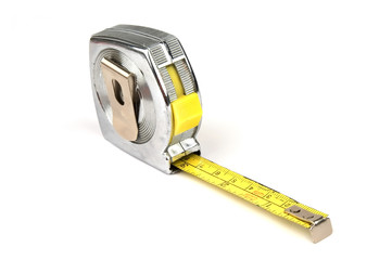 measuring yellow tape tool over white background