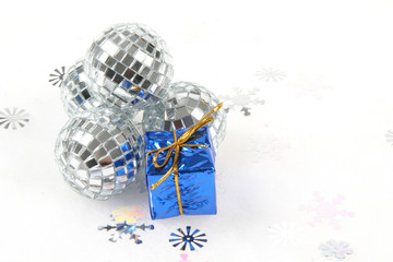 Fototapeta na wymiar sliver glass christmas ornament with blue gift