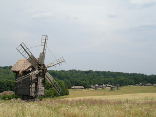 Fototapeta na wymiar wildmill on field and blue sky