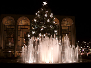 illuminated fountains and  decorated christmas tree, New York, USA