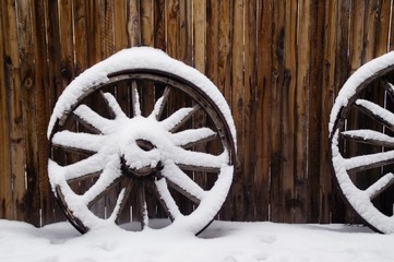 antique wagon wheels in snow