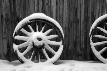old wagon wheels in snow