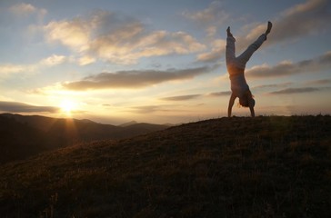 acrobatic girl on sunset