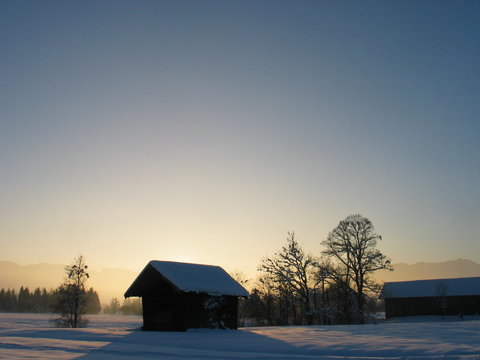 lovely cottage in dreamy sunset winter landscape