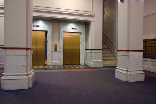 elevators in lobby with door closing