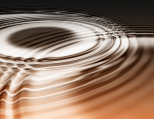 golden oily liquid ripples