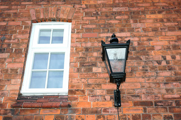 wall,window and old gas lamp