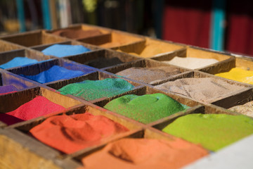 multicolored sand in the boxes