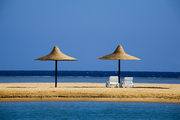 parasols on a beach in the morning