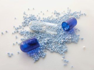 capsules with blue granulated potassium medicine