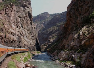 train travels along the river.