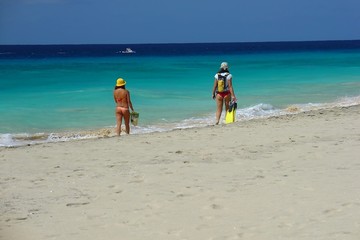 girls walking on the beach