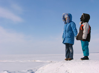 boy and girl on the snow