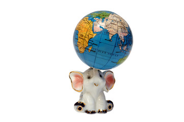 figurine of elephant supporting a globe
