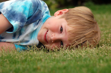 boy lying in grass