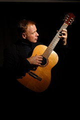 man playing a guitar