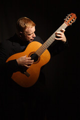 man playing a guitar
