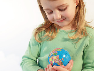 girl holding globe