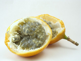 passion fruit cut in half with seeds