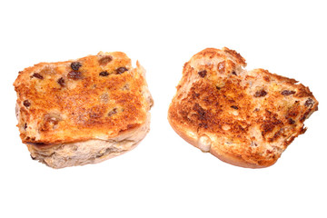 a cut toasted hot cross bun with butter, ready to
