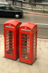 red telephone boxes and black taxi