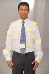 business man covered in post it's