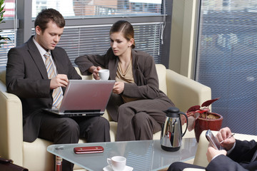 business people sitting in the office and talking