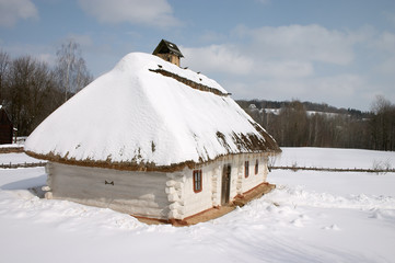 old rural hut under the snow