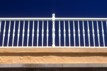 Graphic Iron Railing Against Deep Blue Sky