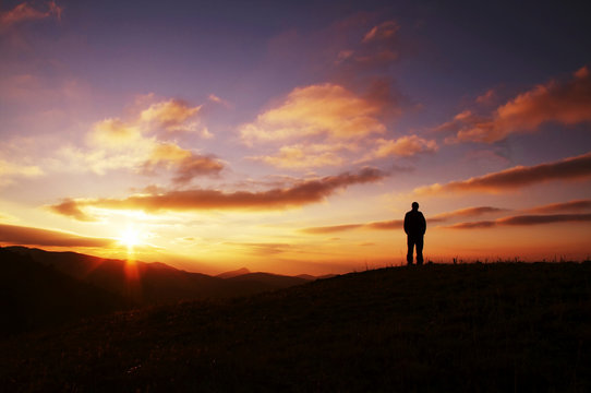 men silhouette on sunset
