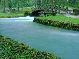 river and cute bridge in nature at morning with long exposure