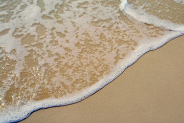 beach detail of a desert island in maldives