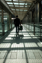 businessman walking on modern bridge