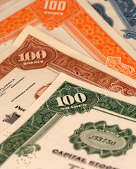 brightly colored stock certificates
