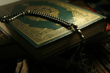 book of holy koran & rosary