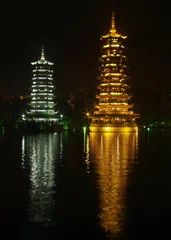 Gordijnen twin pagoda at at night © Gary