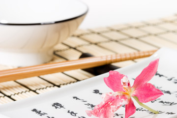 sushi set and pink orchid flower