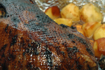 big roasted chicken with potato