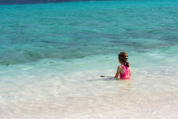 girl in the water in a yoga posture