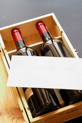 wood gift box with two wine bottles and blank card