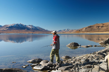 Fototapeta na wymiar fishing on mountain lake
