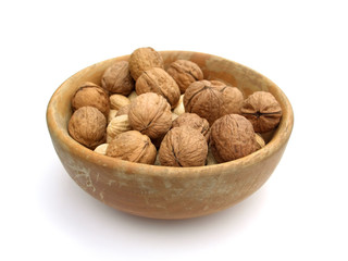 walnuts in a bowl, isolated on white