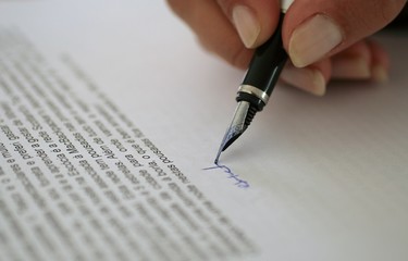 woman signing contract