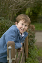 a boy on a gate