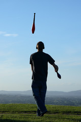 juggler at dusk