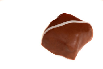 a piece of semi-sweet chocolate isolated on white