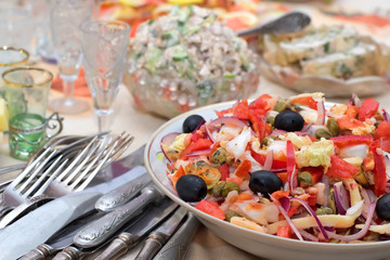 salad from seafoods with olives and vegetables
