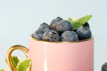coffee cup stuffed with blueberries